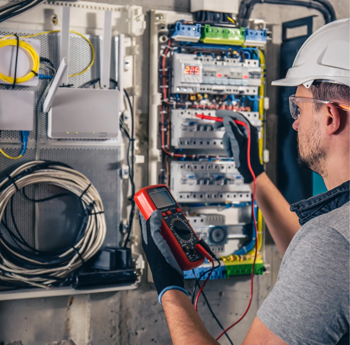 Technician inspecting electrical wiring system